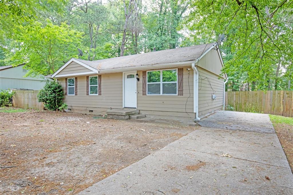 front view of a house with a yard