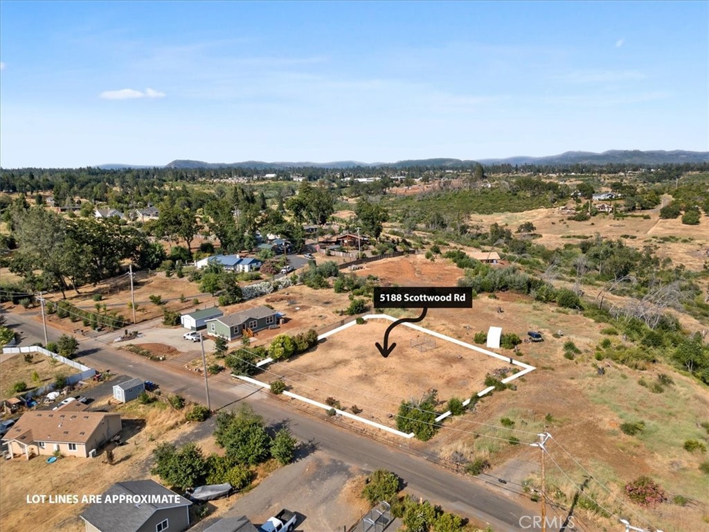 an aerial view of residential building and ocean