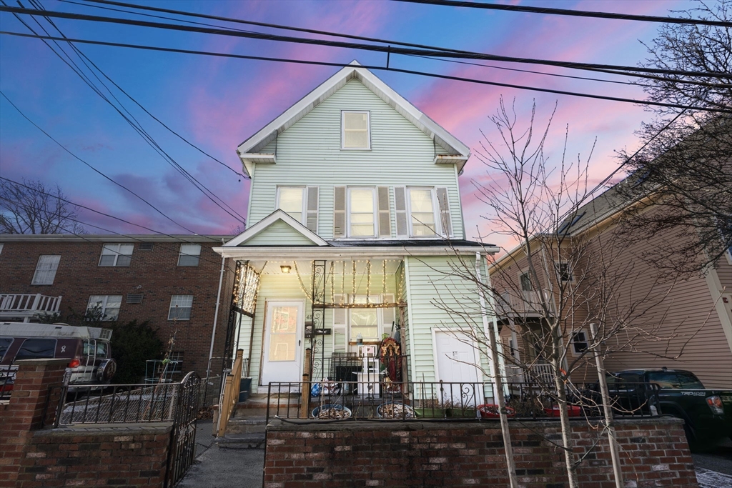 a front view of a house with glass windows