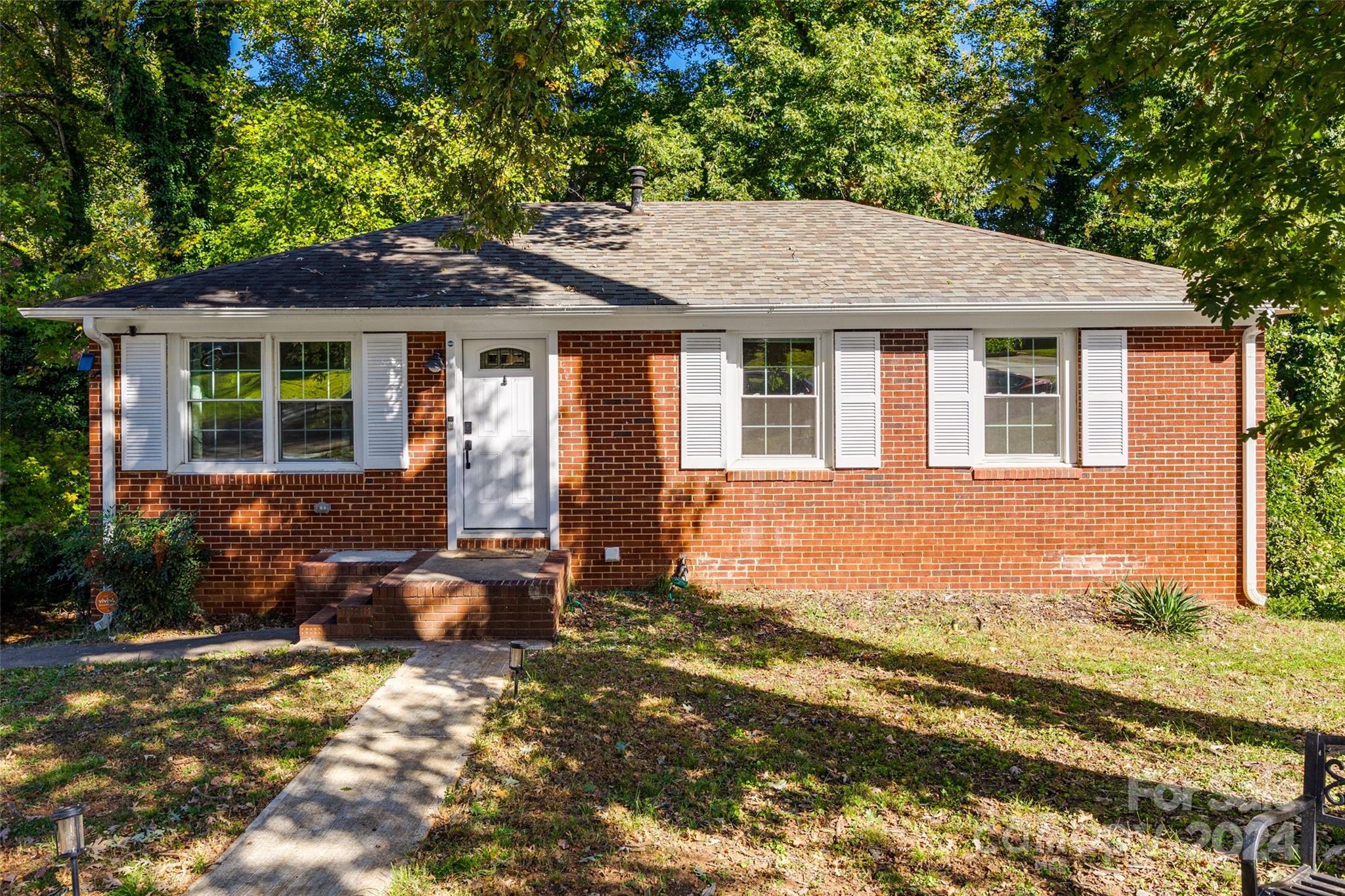 front view of a house with a yard