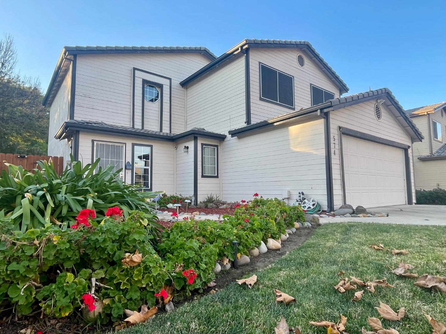 a house view with a backyard space