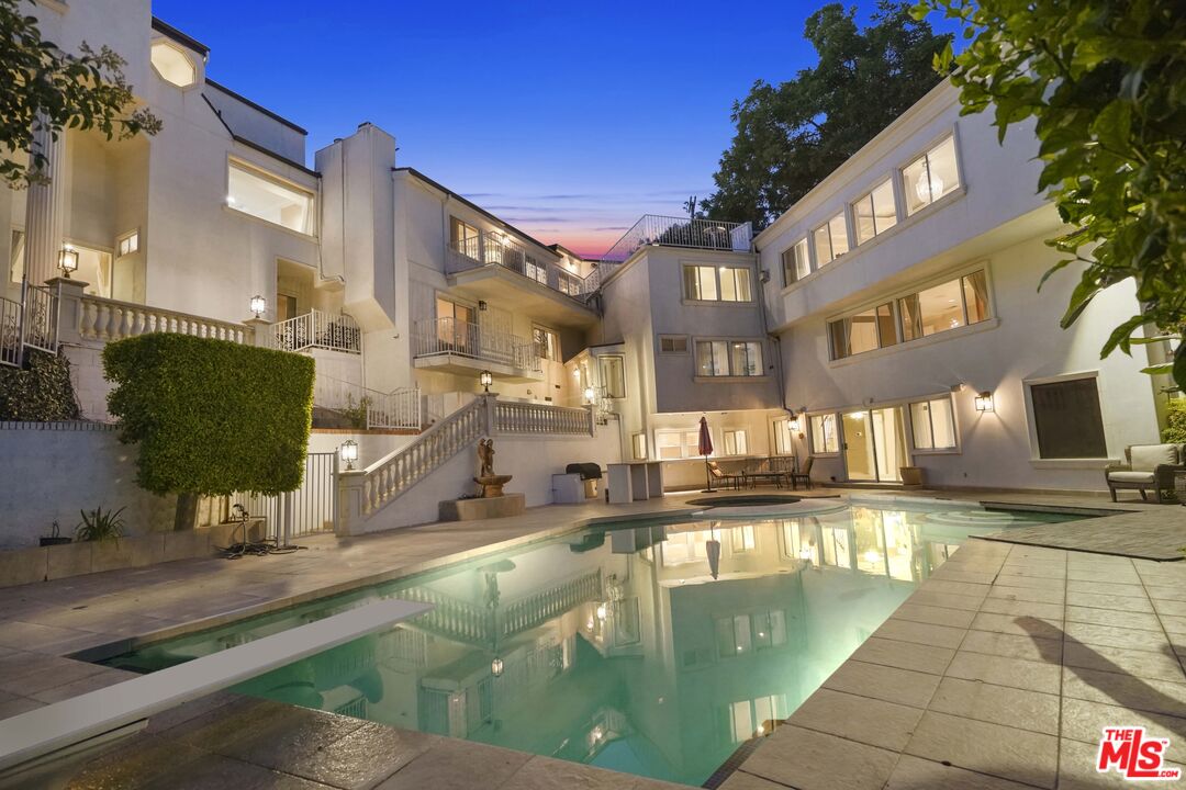 a view of a swimming pool with a patio