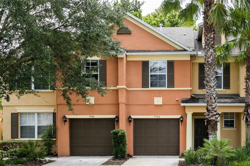 a front view of a house with garage