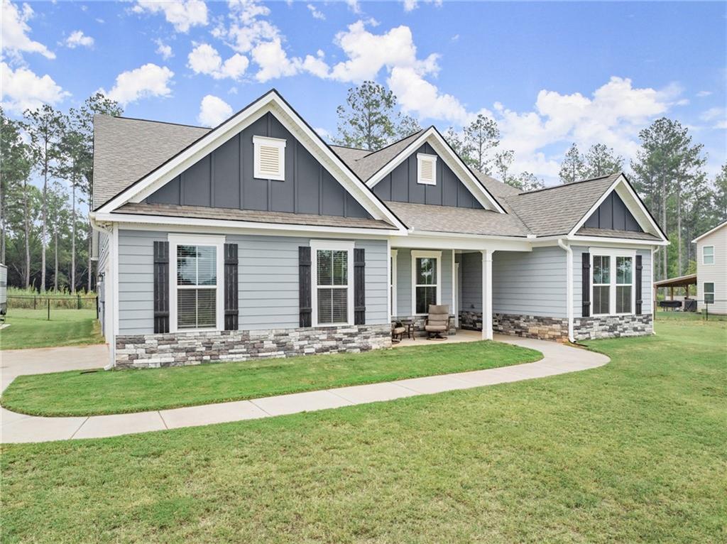 a front view of a house with a yard and porch