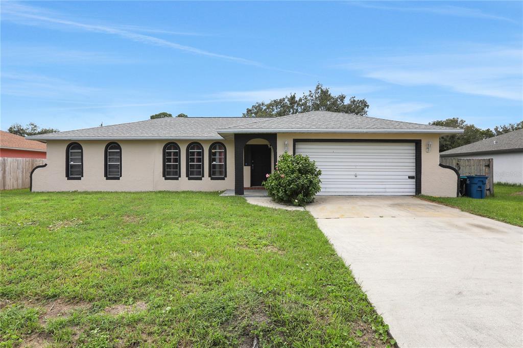 front view of a house with a yard