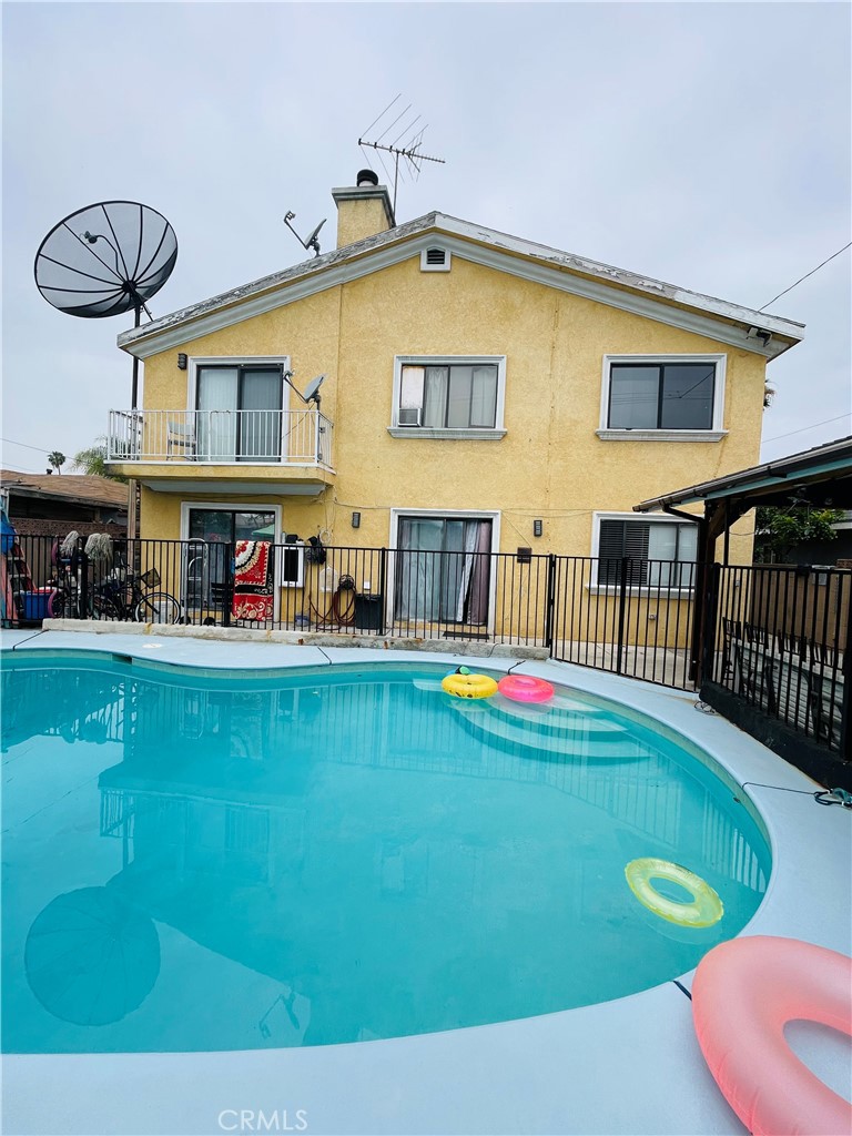 a view of swimming pool with outdoor seating