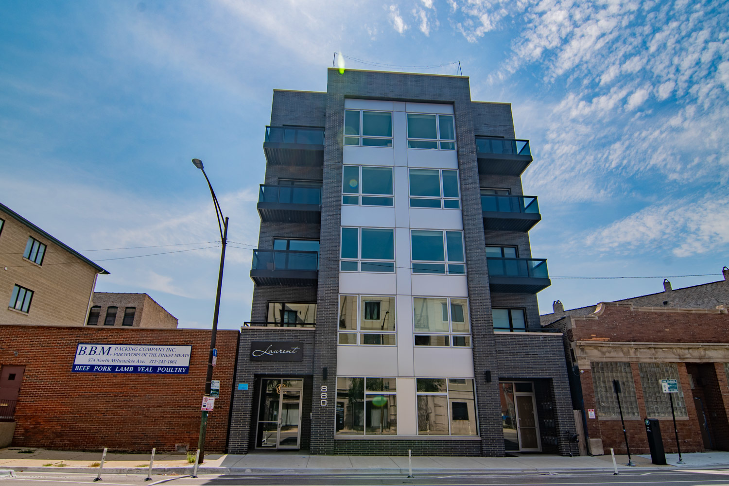 a front view of a building with lot of windows