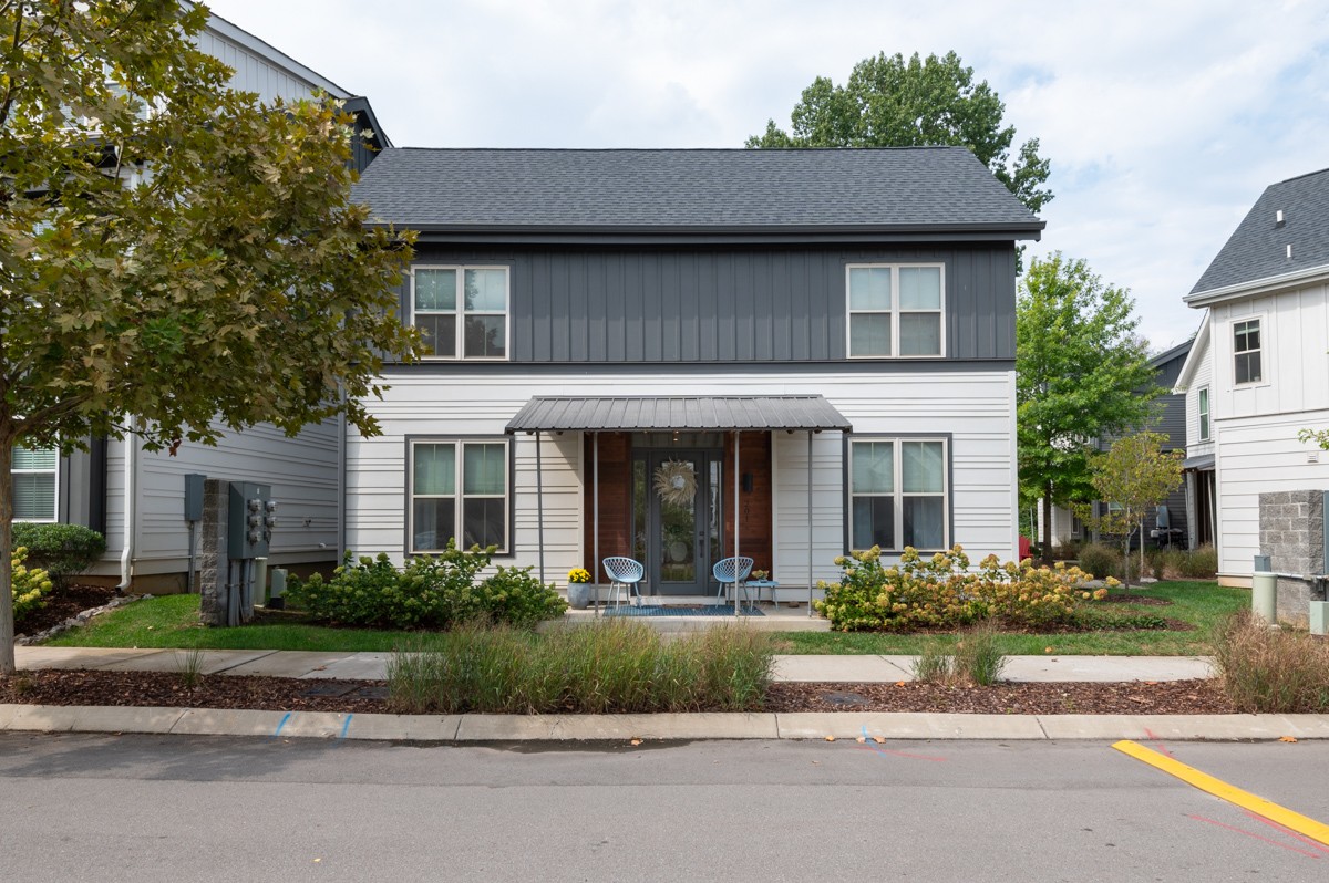 a front view of a house with a yard