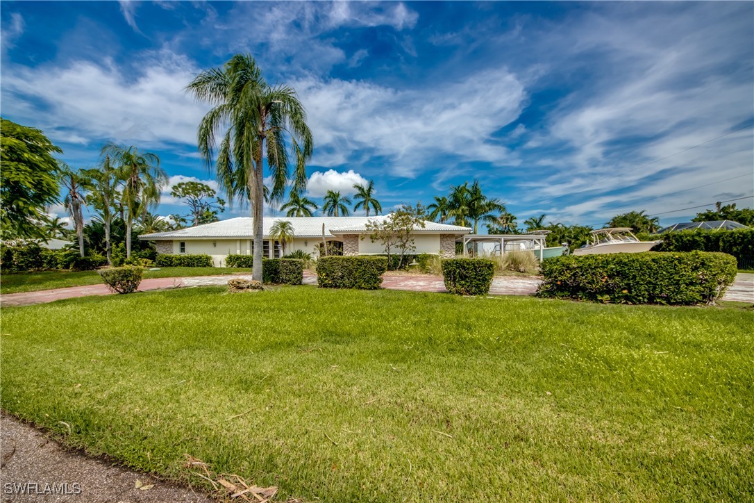 a view of a house with a big yard