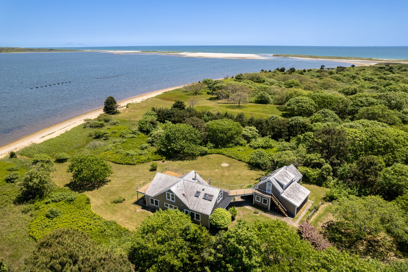 an aerial view of a house with a lake view