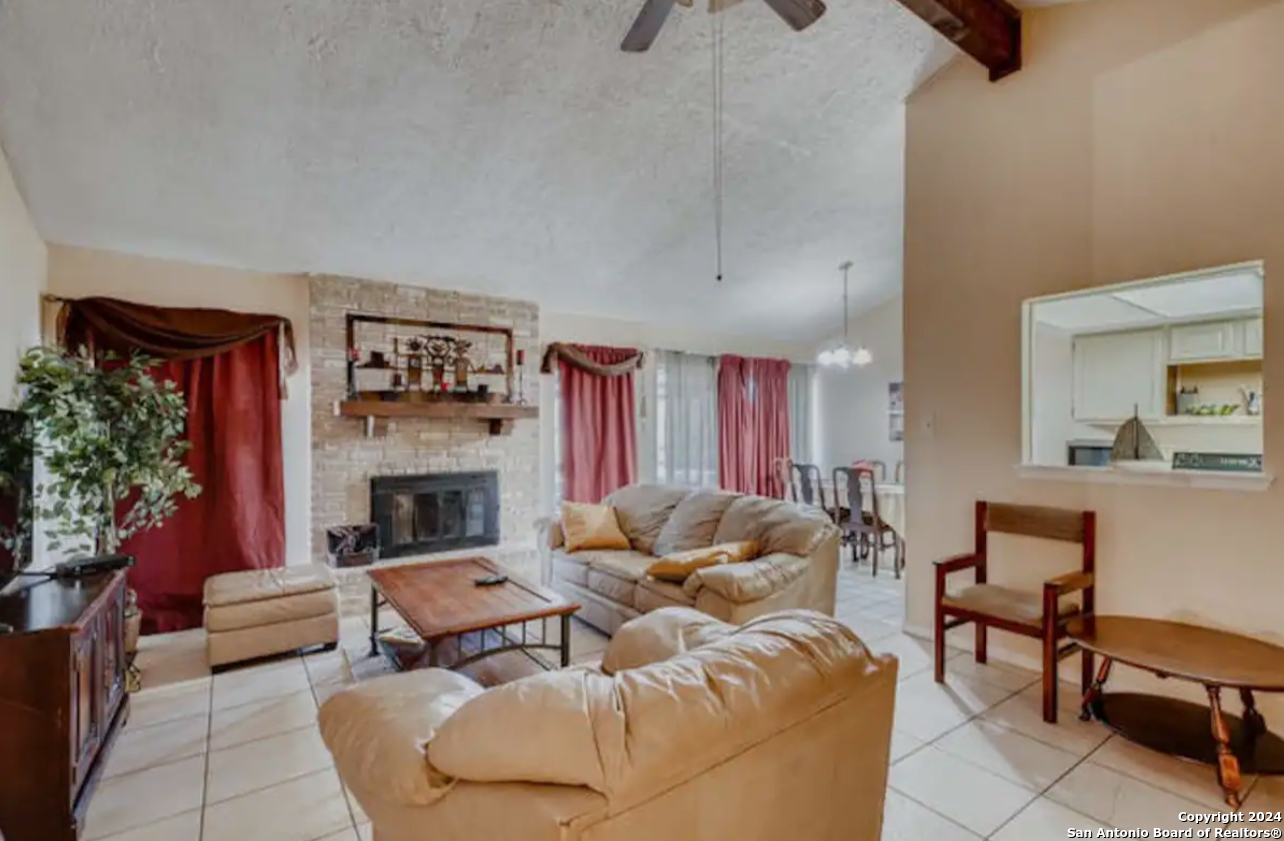 a living room with furniture or couch and a fireplace