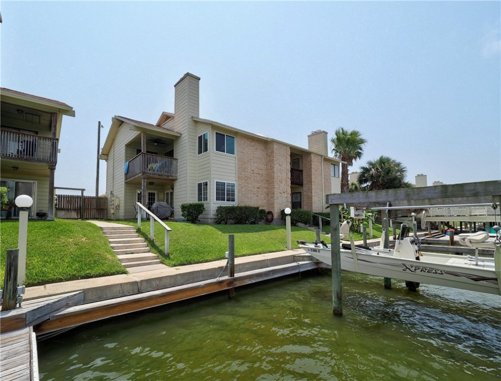 a swimming pool with outdoor seating and yard