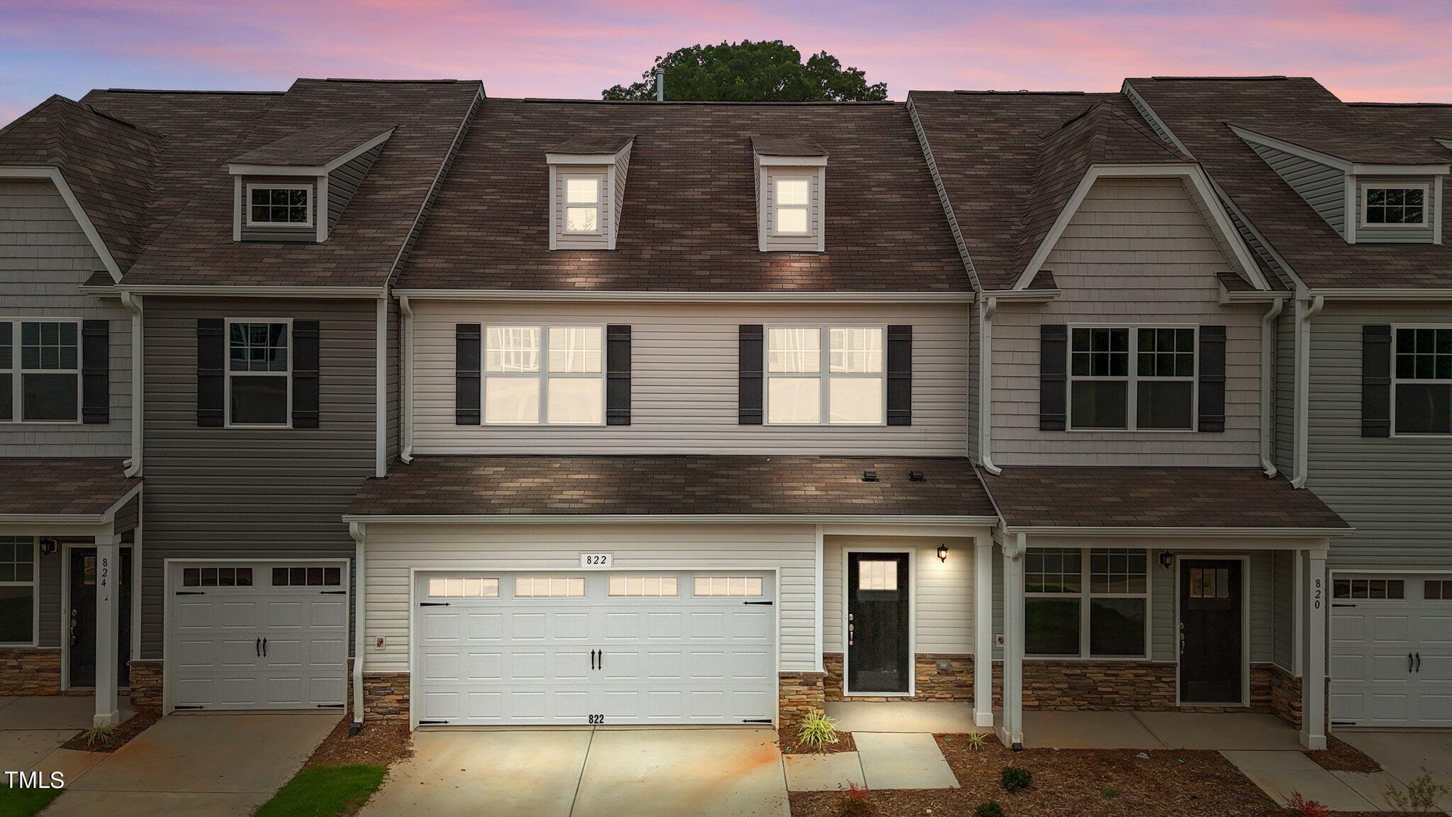 a front view of a house with a garage