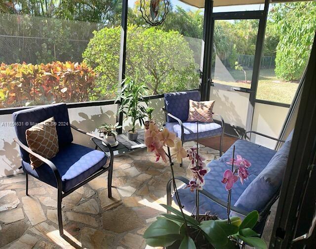 a view of a chairs and table in the balcony