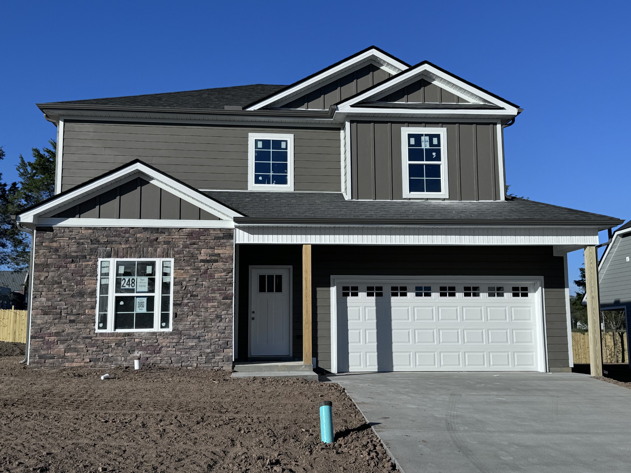 a front view of a house with garage