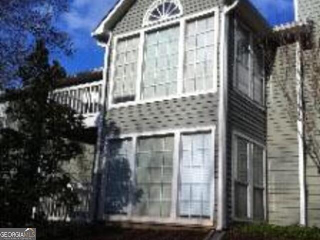 a front view of a house with a glass door