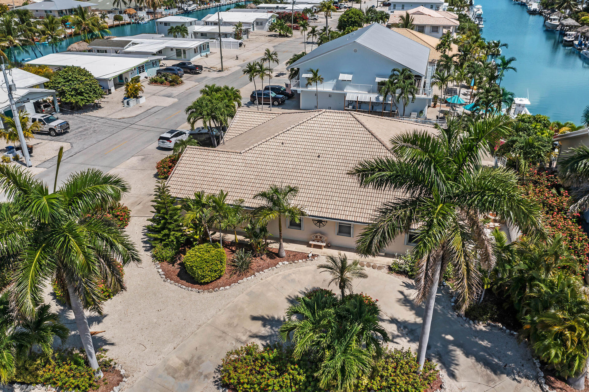 an aerial view of a house with a yard and garden