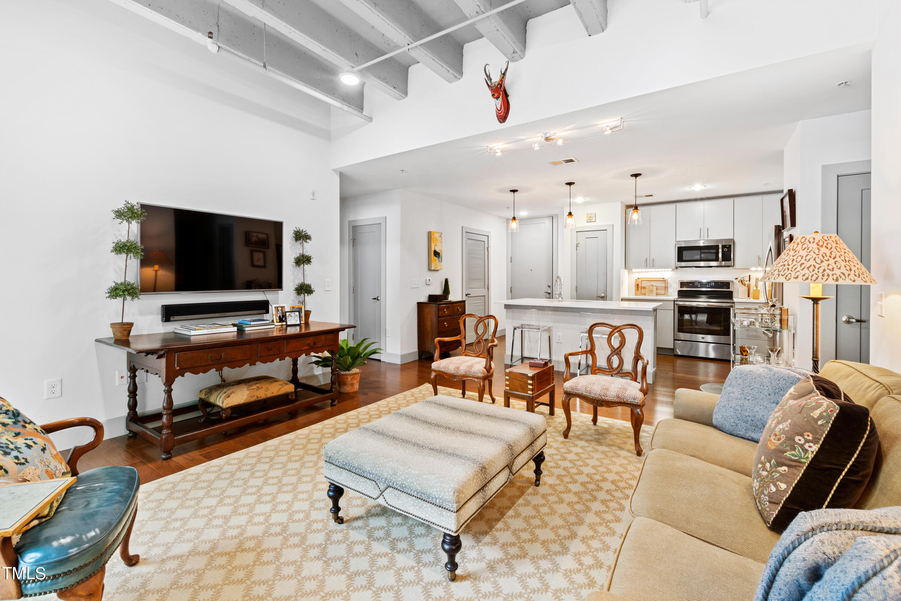 a living room with furniture and a flat screen tv