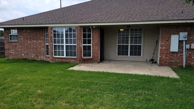 a view of a back yard of the house