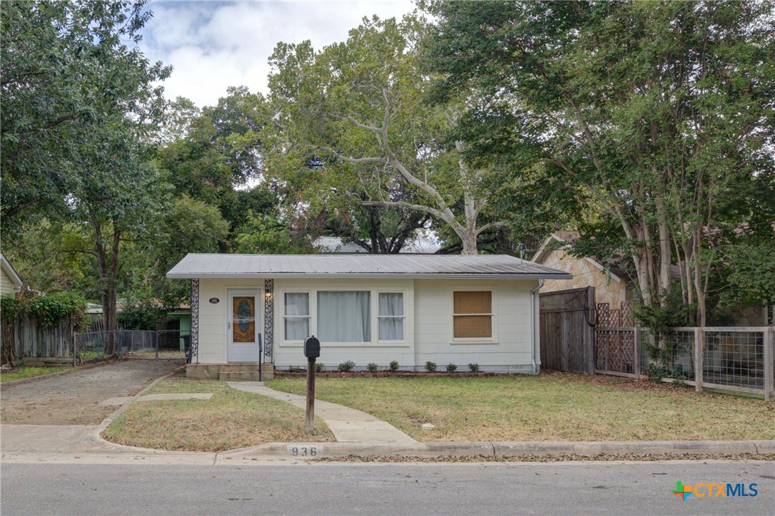 front view of a house and a yard