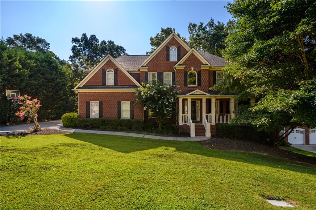 a front view of a house with a yard