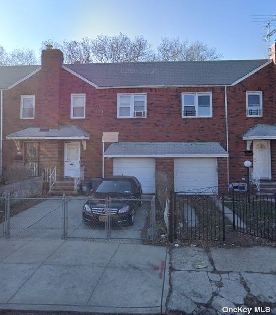 a brick building with a bench in front of it