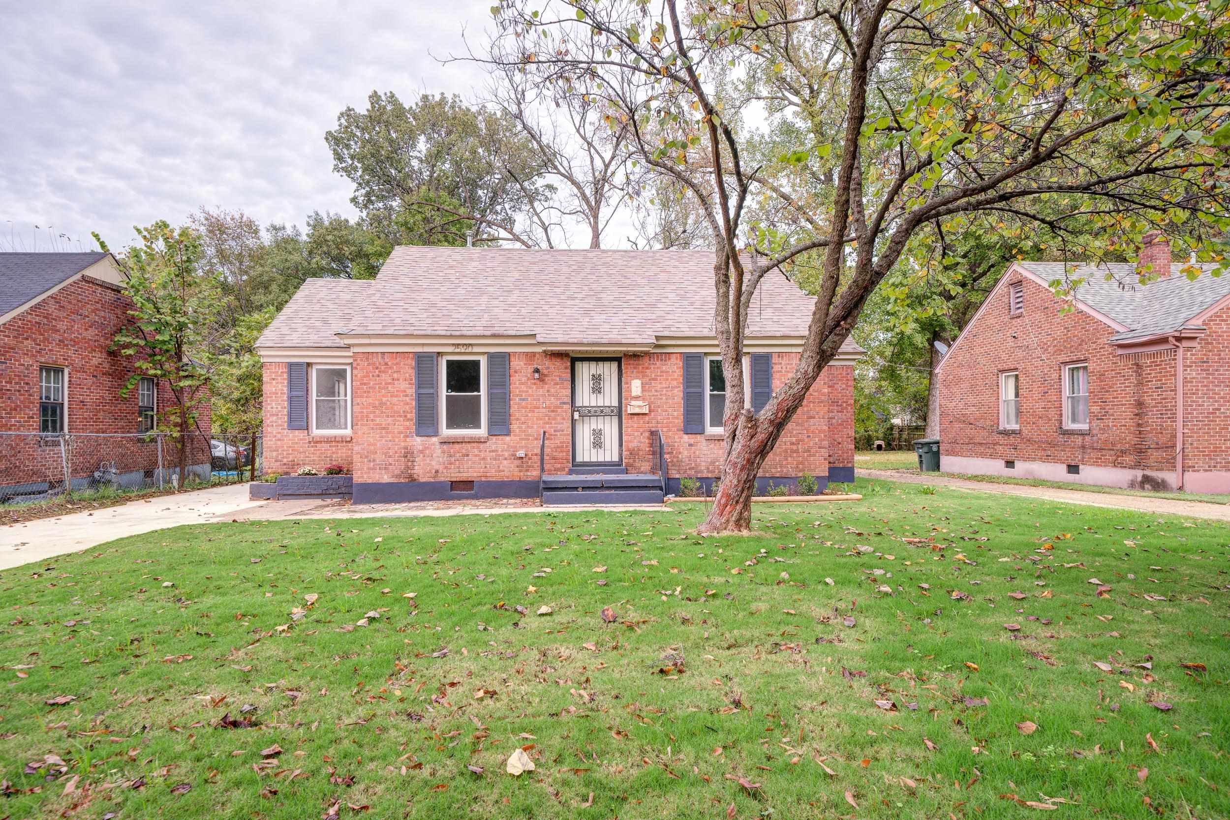 Single story home featuring a front lawn