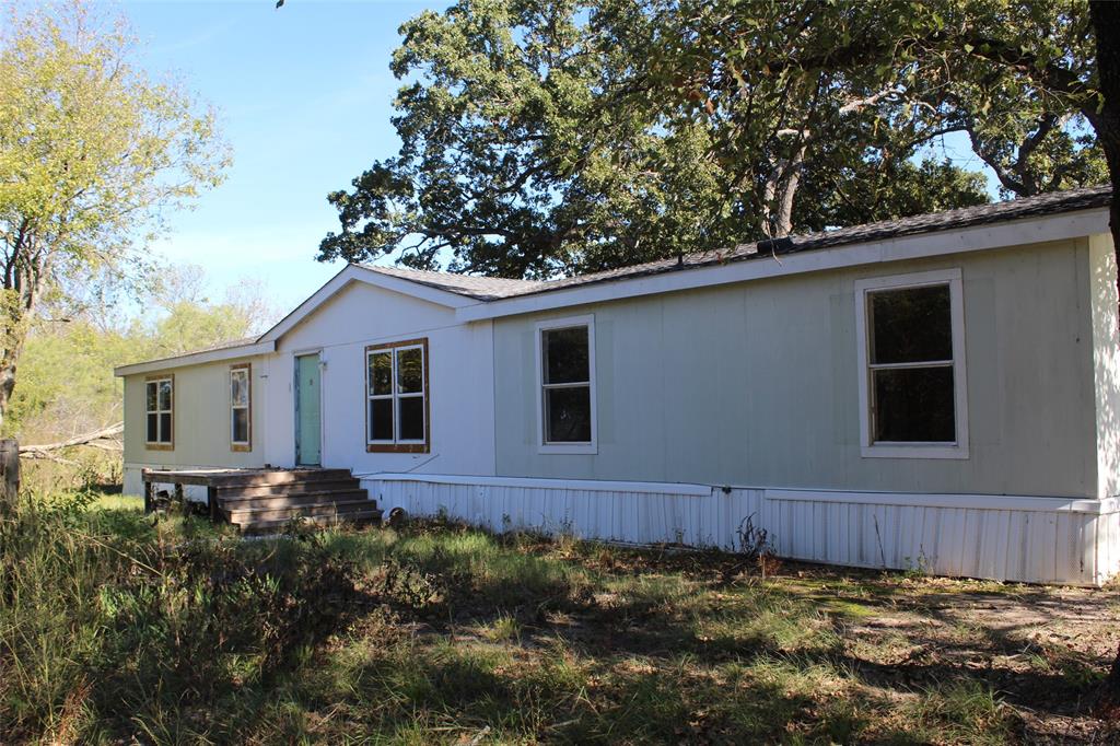 a view of front a house with a yard