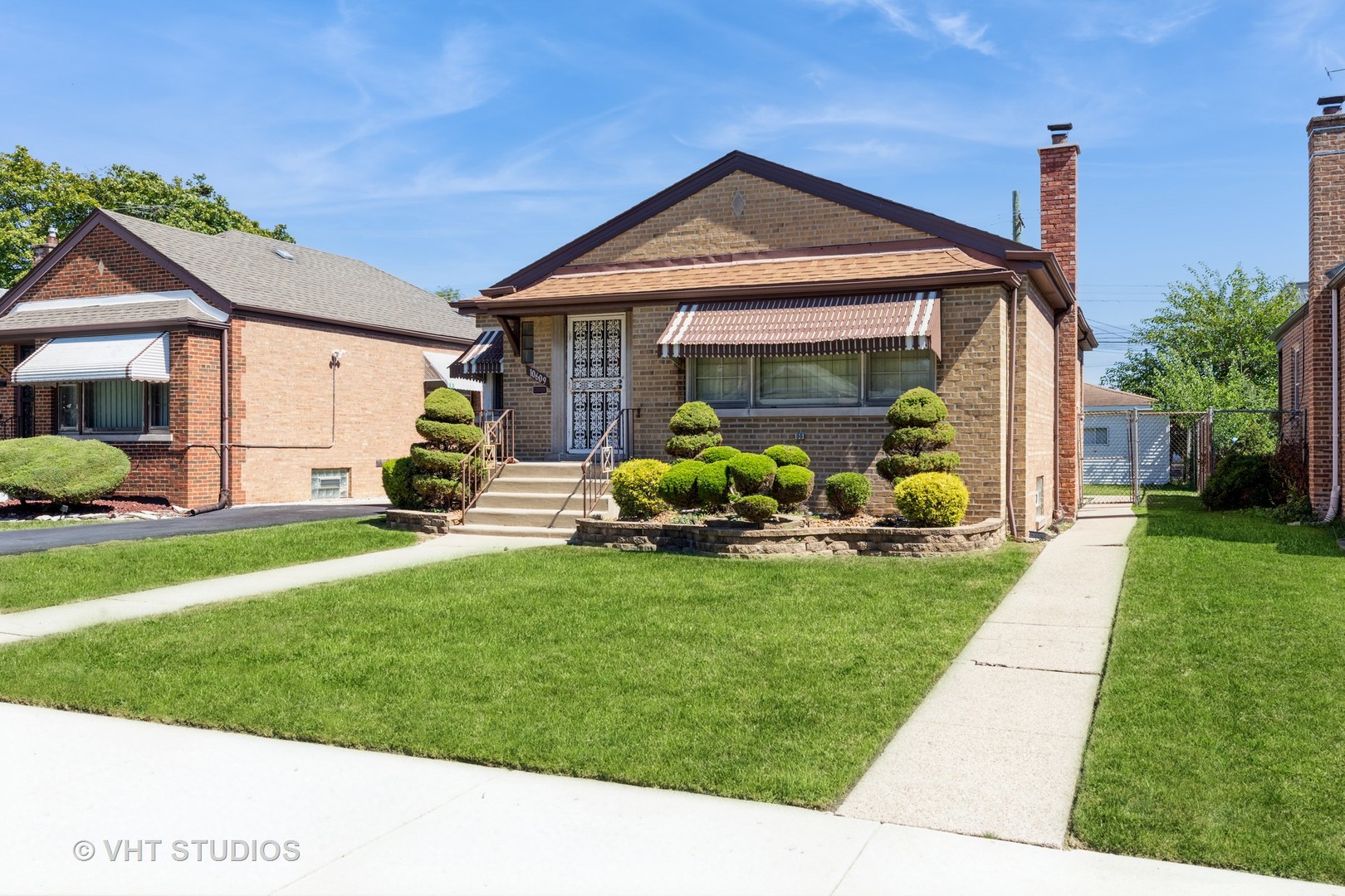 a front view of a house with garden