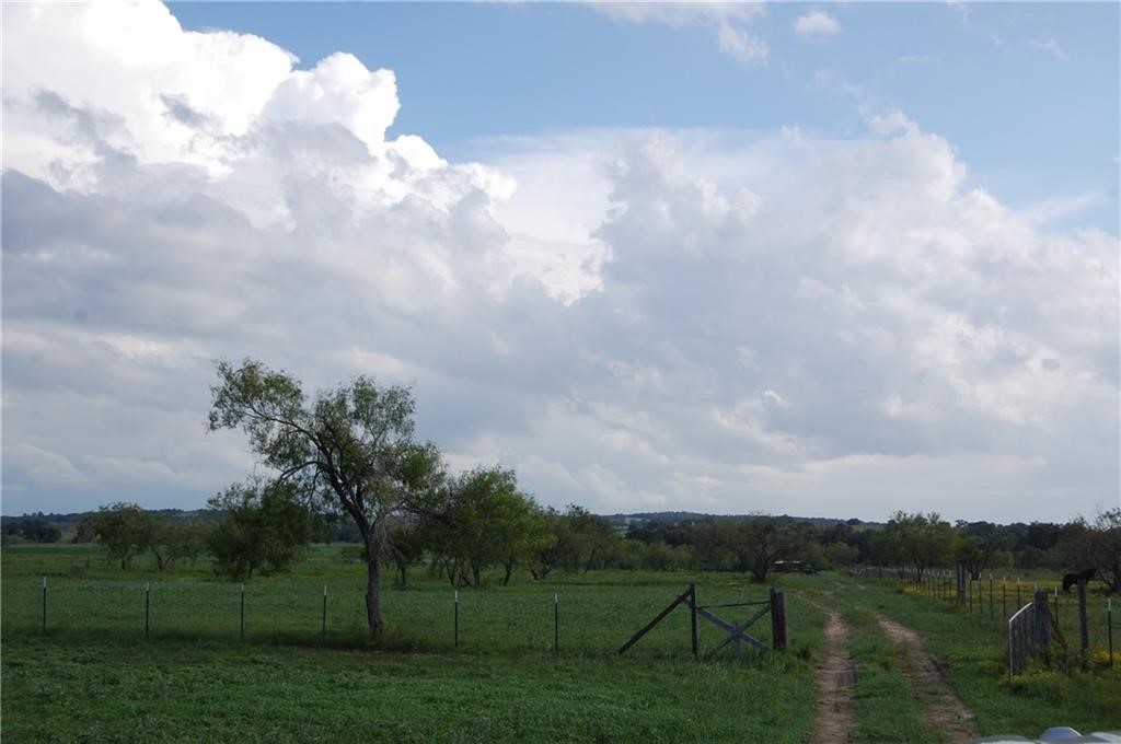 a view of a lake with a big yard