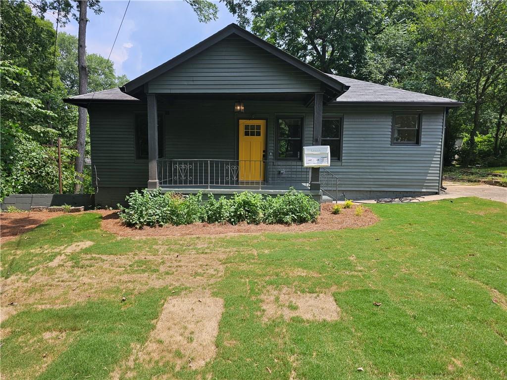 a front view of a house with garden