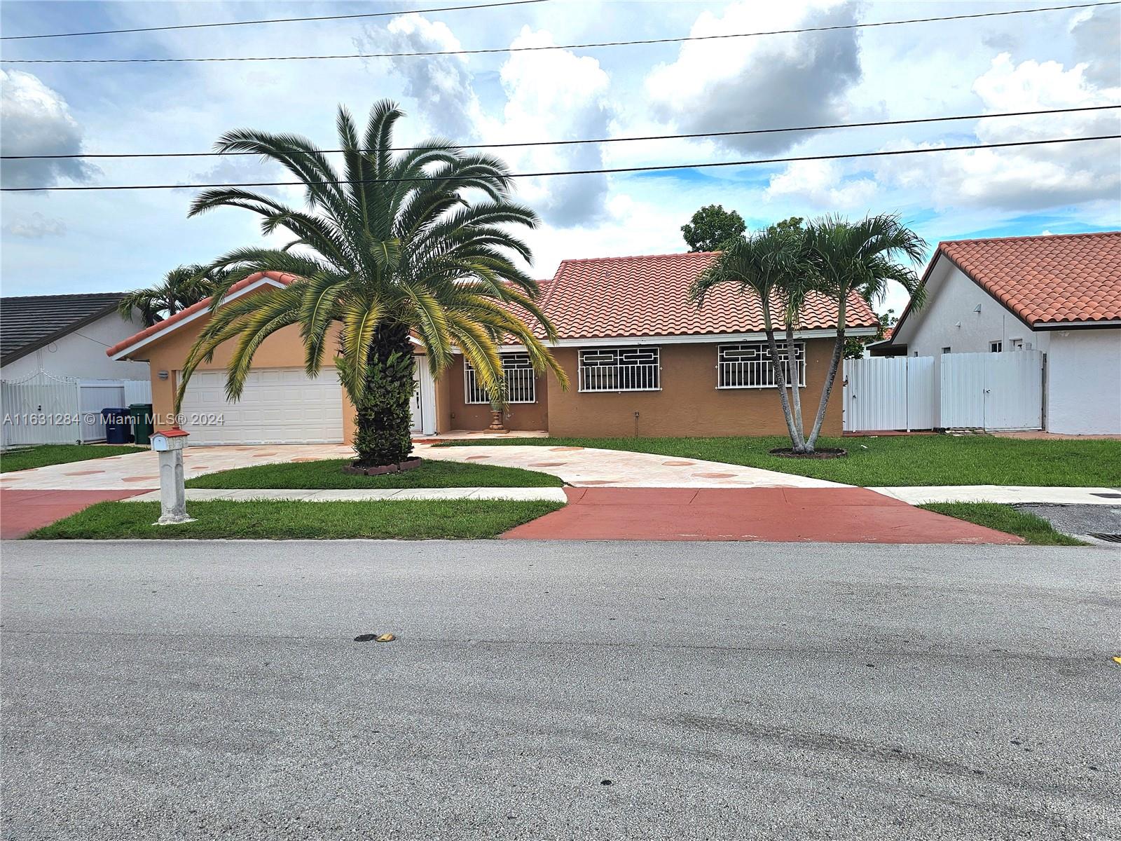 a house with palm tree in front of it