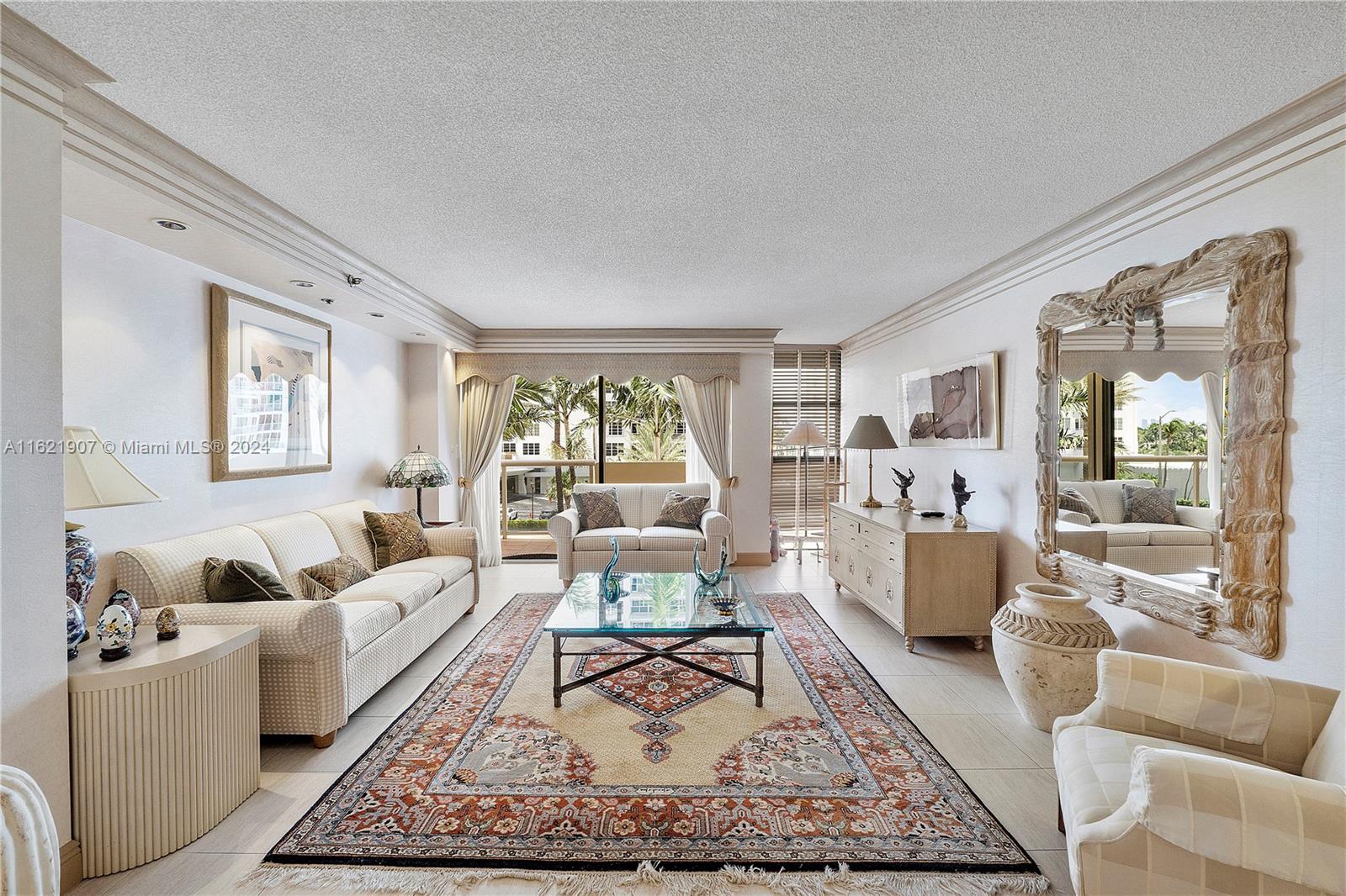 a living room with furniture and a rug