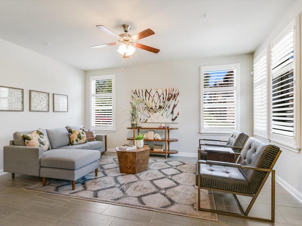 a living room with furniture and a large window