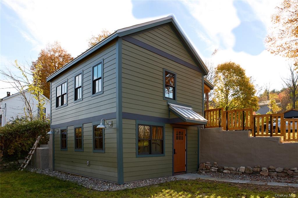 a front view of a house with garage