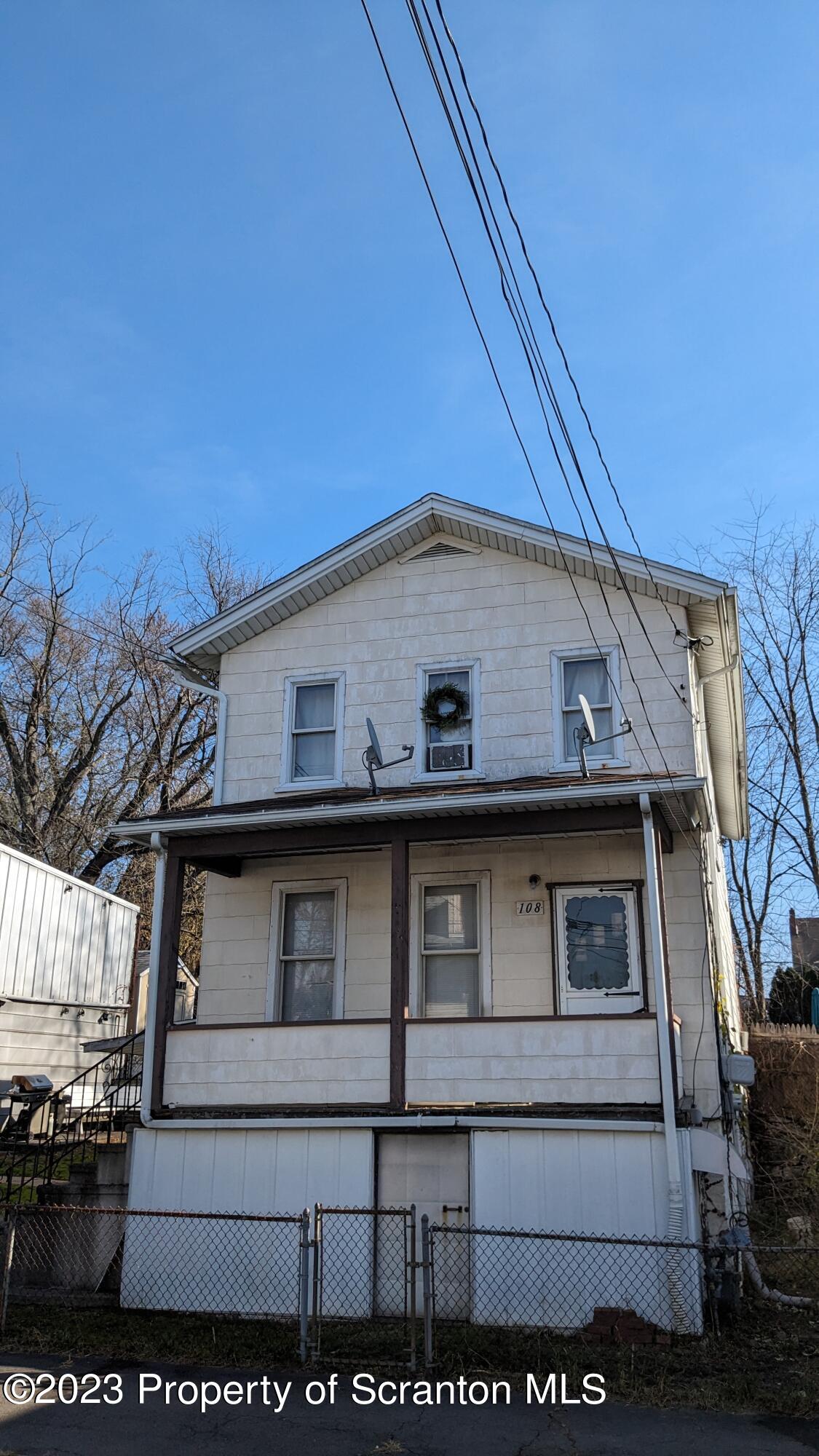 a view of a house with large windows