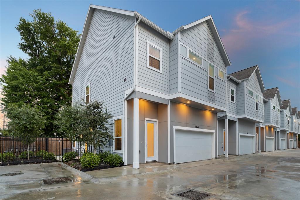 a front view of a house with a garage