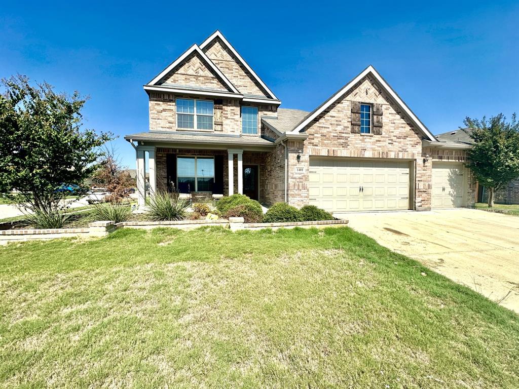 front view of a house with a yard