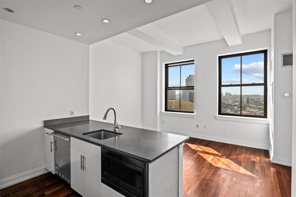 a kitchen that has a sink and a stove