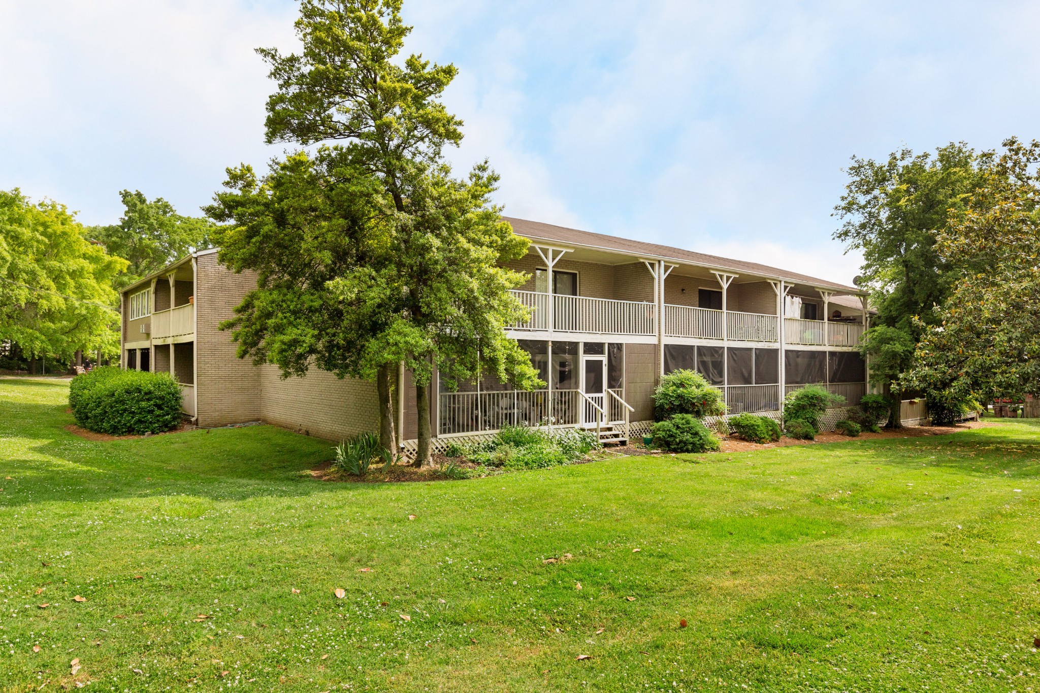 a view of a building with a yard