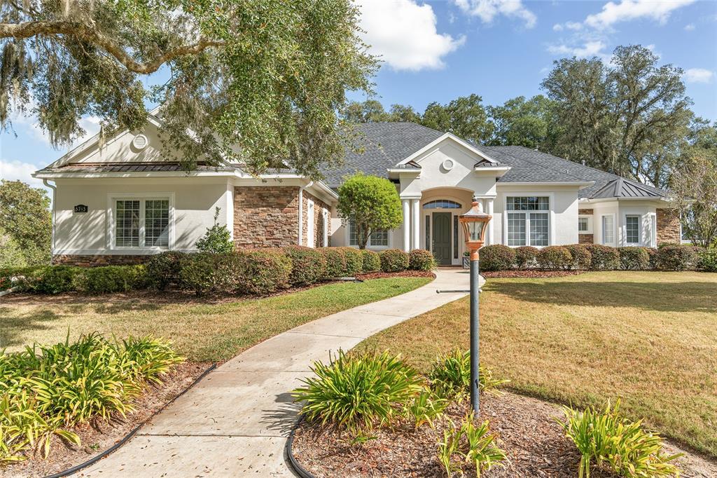 front view of a house with a yard