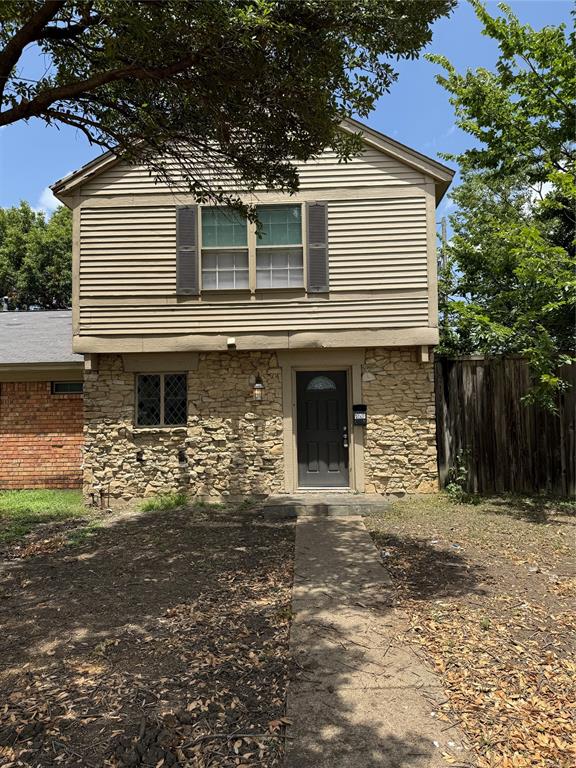 a front view of a house with garage