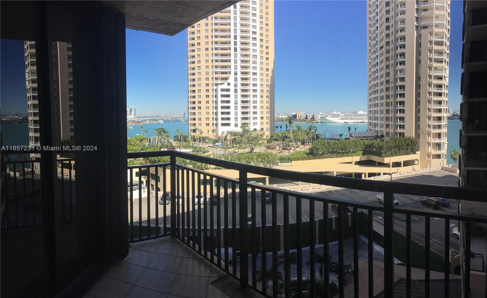 a view of a balcony with wooden floor