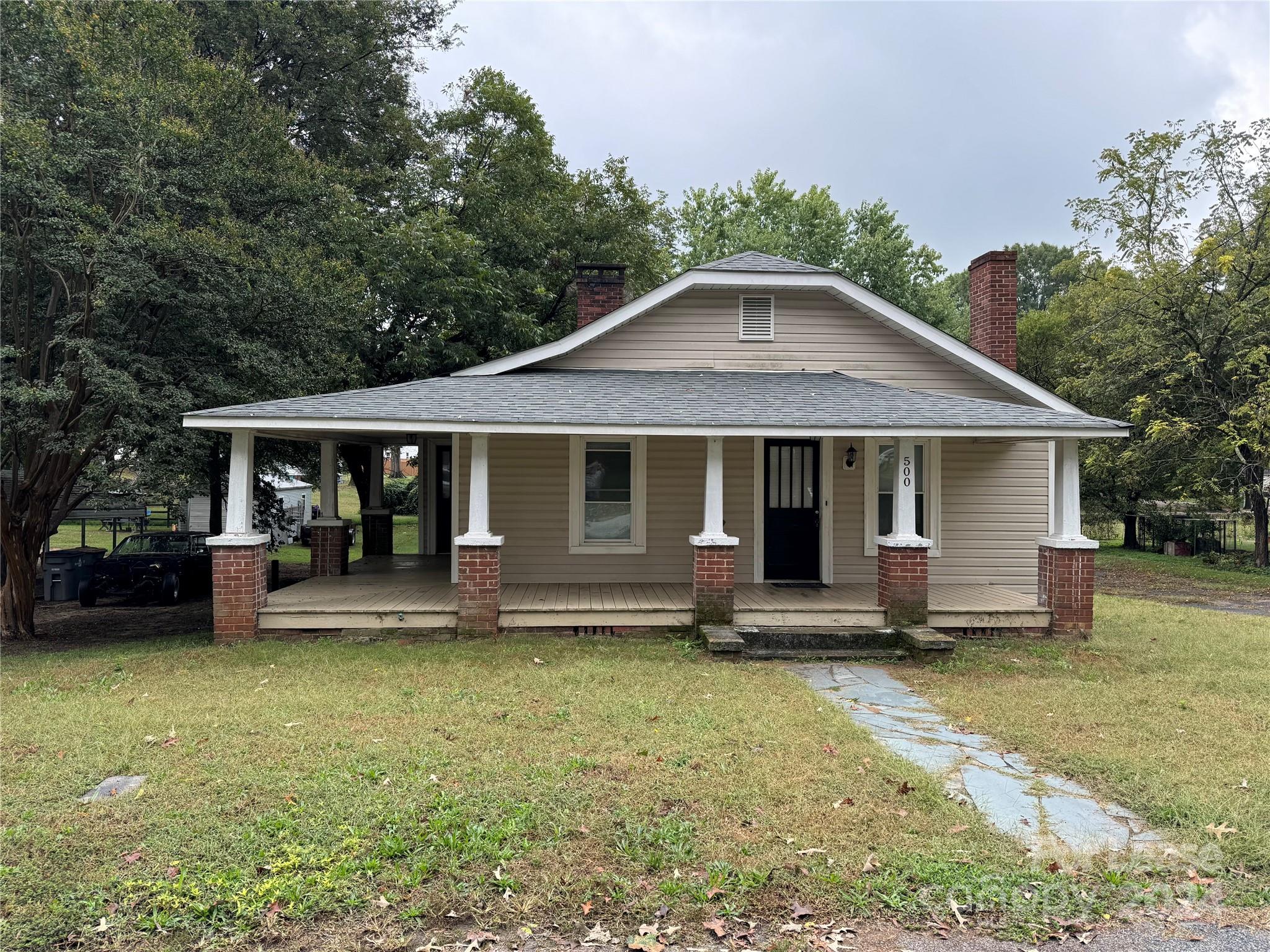 front view of a house with a yard