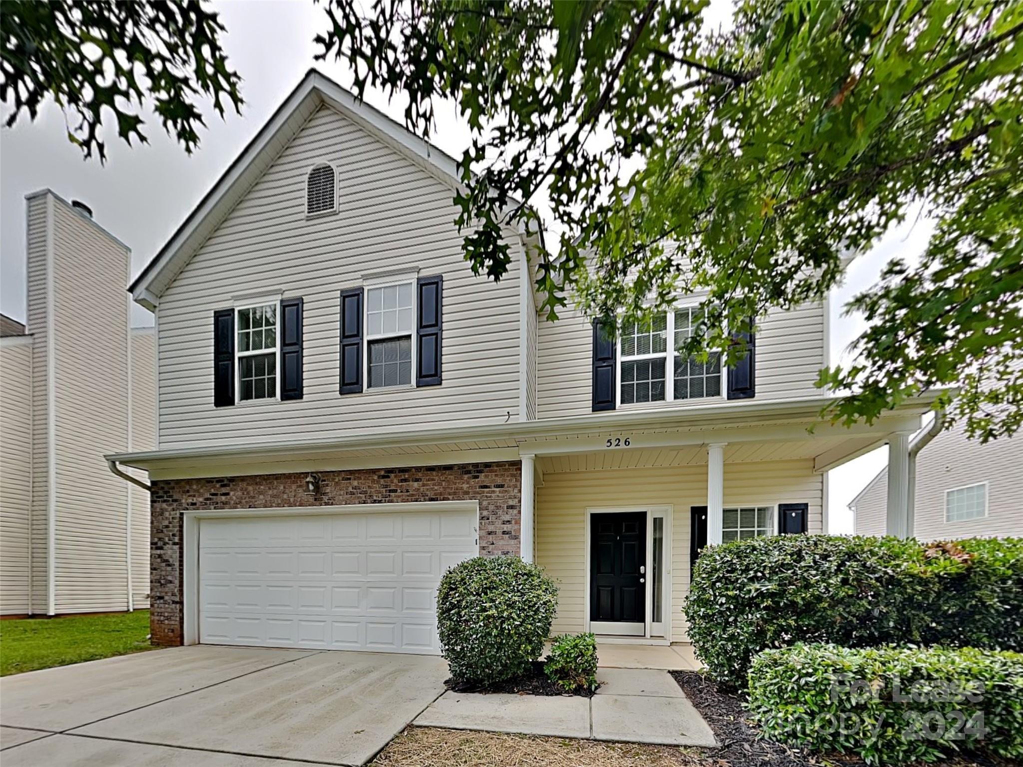 a front view of a house with a garage