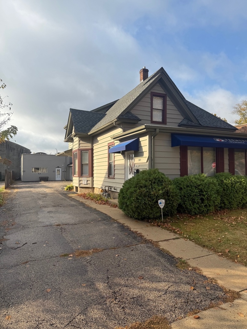 a view of a house next to a yard