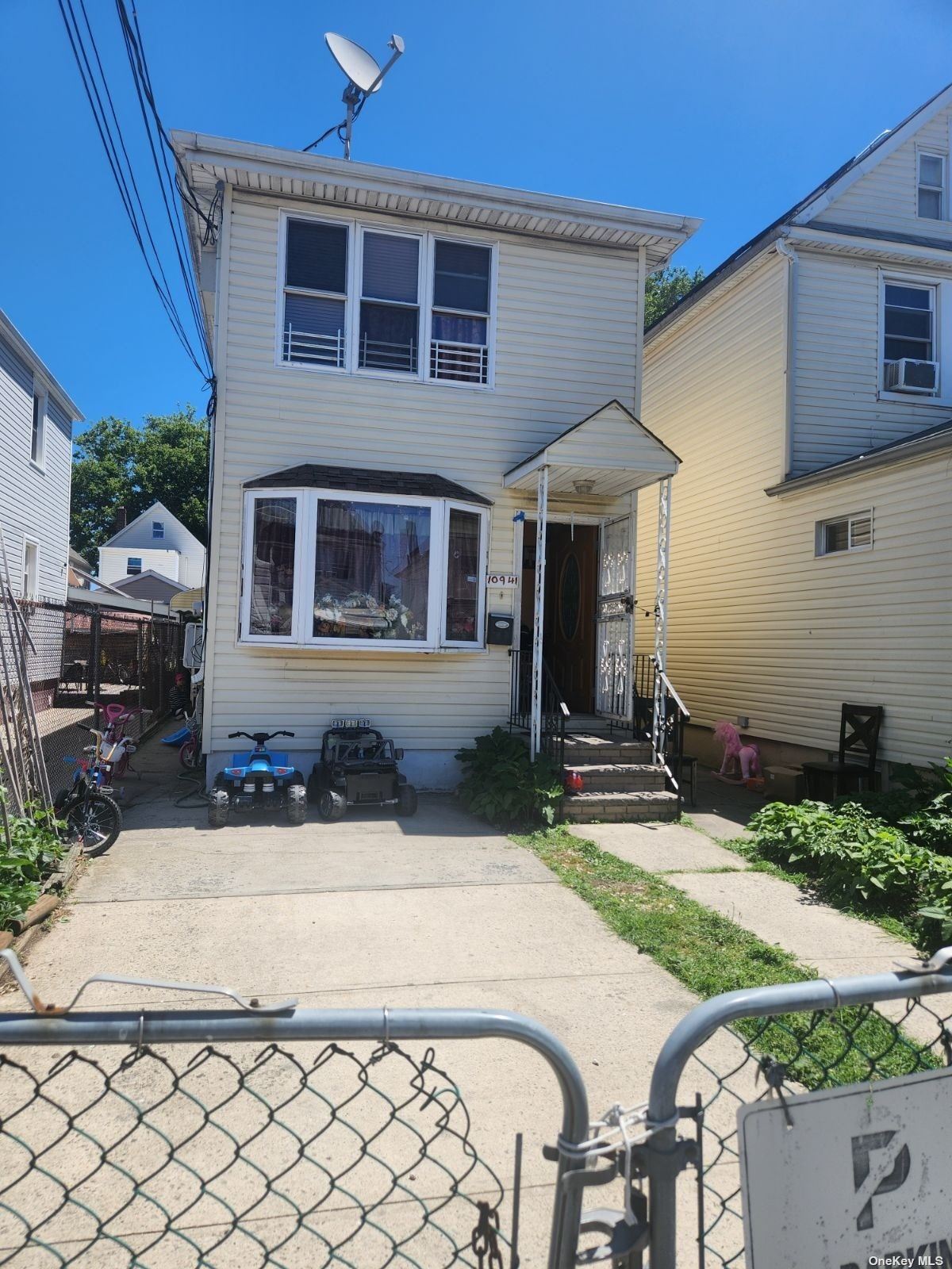 a view of house with yard outdoor seating area