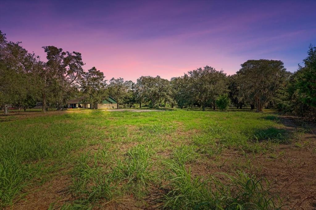 Discover your dream retreat on a secluded, partially wooded 40,600 square feet of space, with Trinity Bay views.