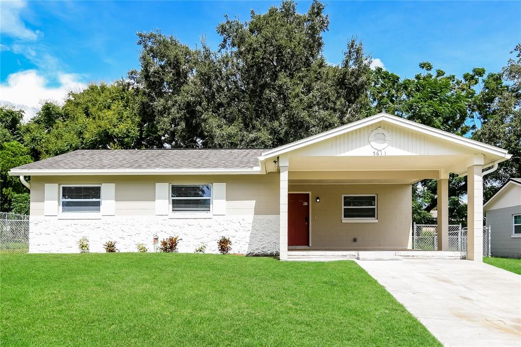 a front view of house with yard and green space