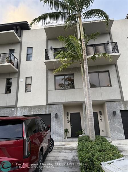 a front view of a house with parking